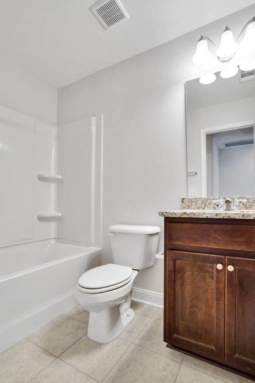 Harris Trail Luxury Townhomes for rent Richmond Hill, GA photo of bathroom with vanity, toliet and tub.
