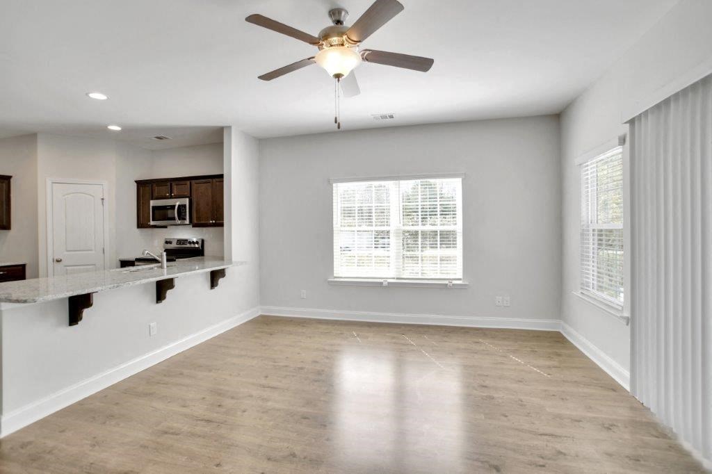 Harris Trail Luxury Townhomes for rent Richmond Hill, GA photo of living room with large window