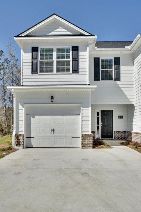 Harris Trail Luxury Townhomes for rent Richmond Hill, GA photo of white townhome with garage