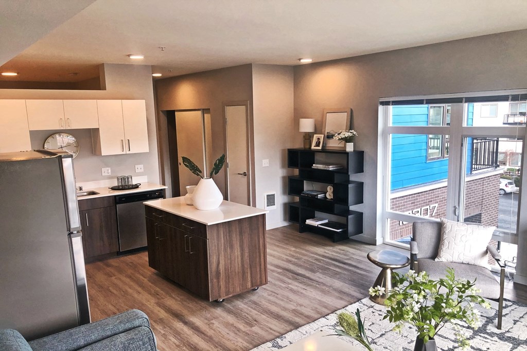 a kitchen and living room in an apartment
