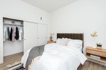 East of Eleven Apartments in Portland, OR with Wall to wall carpet, double closet, and white walls
