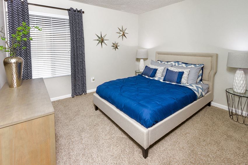 Apartments in Downey - Park Regency Club - Bedroom with Plush Carpeting and Large Window