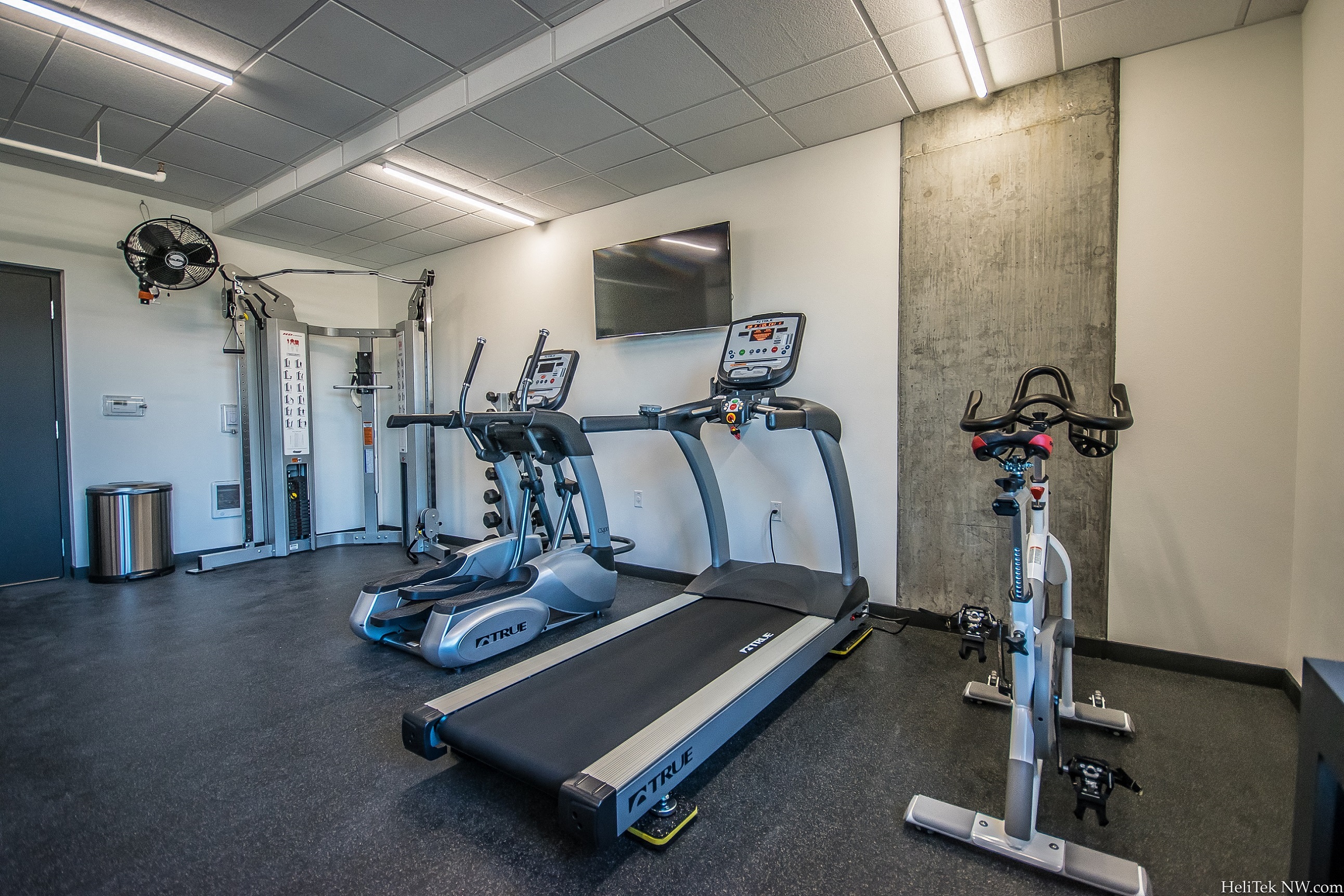 Portland, OR Apartments for Rent - Corbett Heights Fitness Center with an Exercise Bike, a Treadmill, and an Elliptical