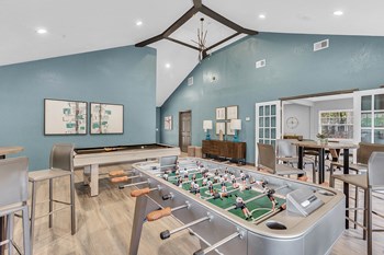 Apartments in Brandon, FL - Reserve at Brandon Apartments Game Room With Pool Table, Foosball Table and Bar Tables and Chairs - Photo Gallery 4