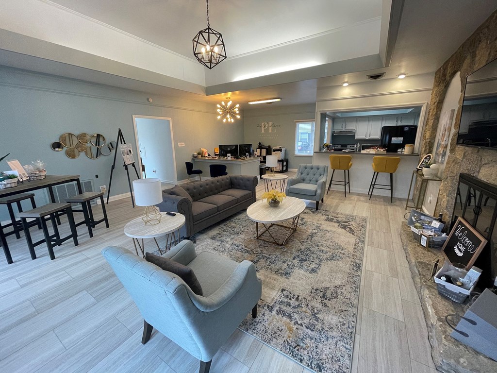 a living room with couches and chairs