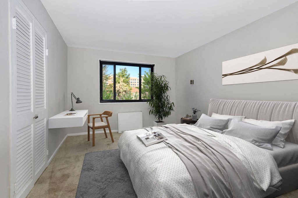 a bedroom with a bed and a window