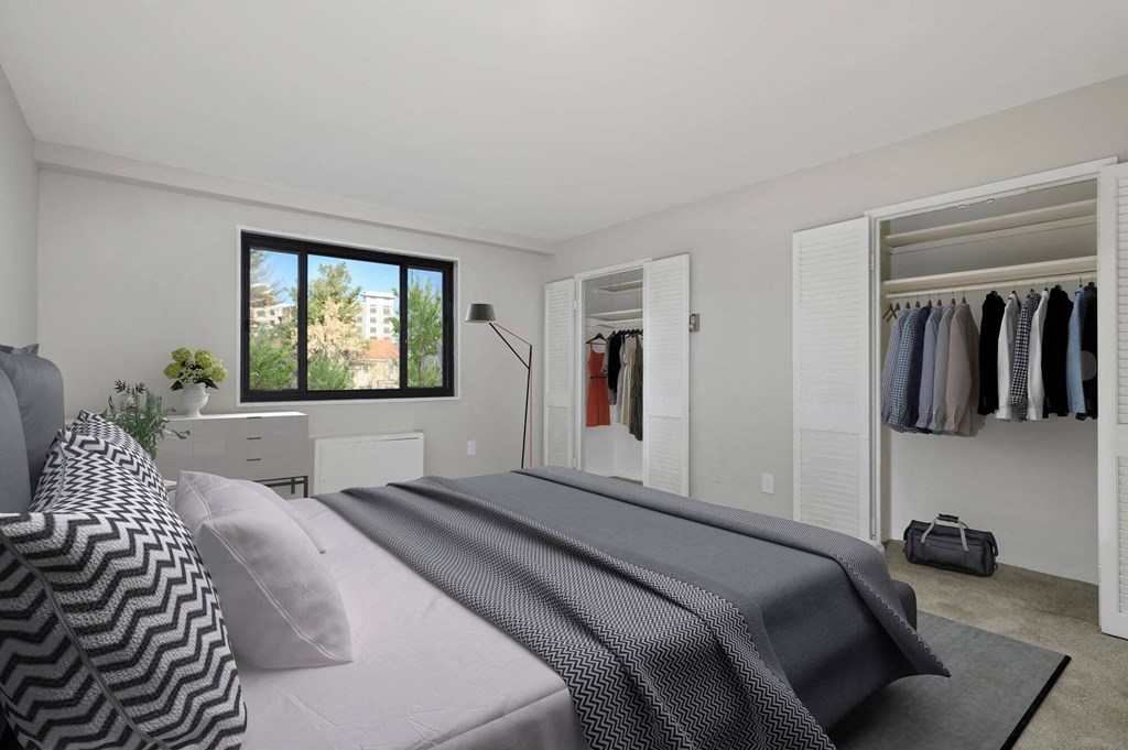 a bedroom with a bed and a closet