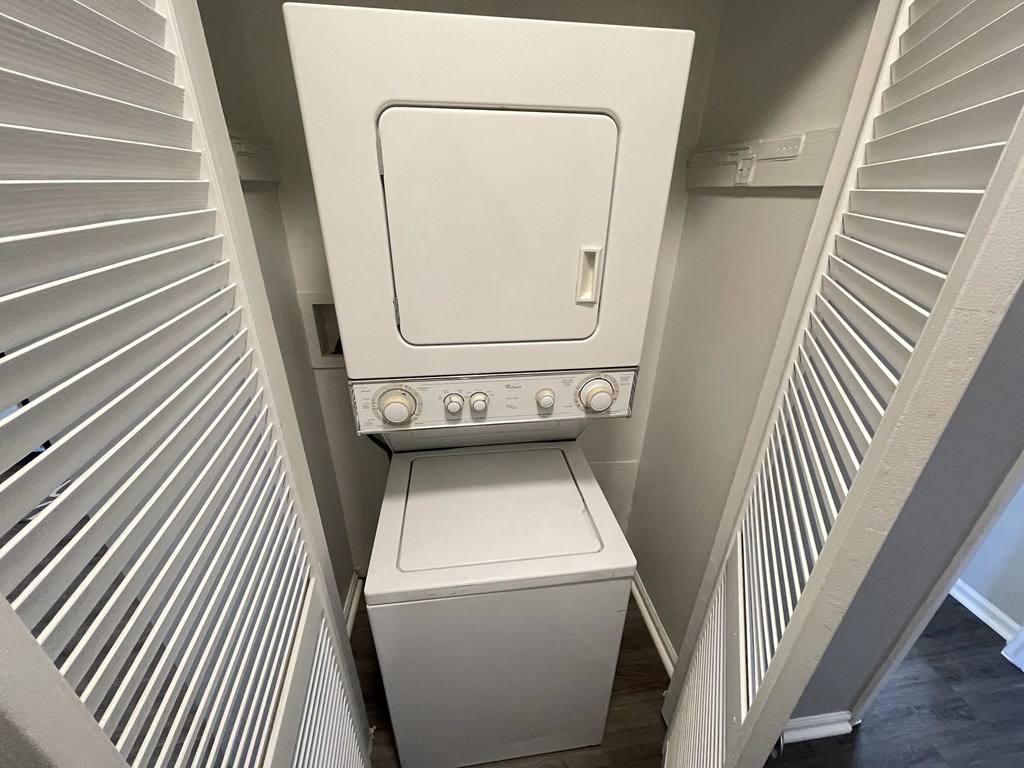 a very sunny room, about 20 sqm with a window. a flat screen tv and