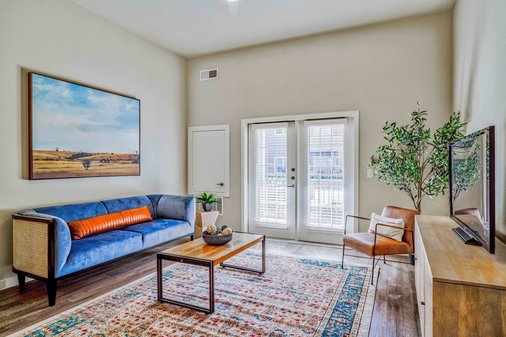 a living room with a couch and a coffee table at LIV at Boerne Hills an Active Senior Community 62+, Boerne, TX, 78006