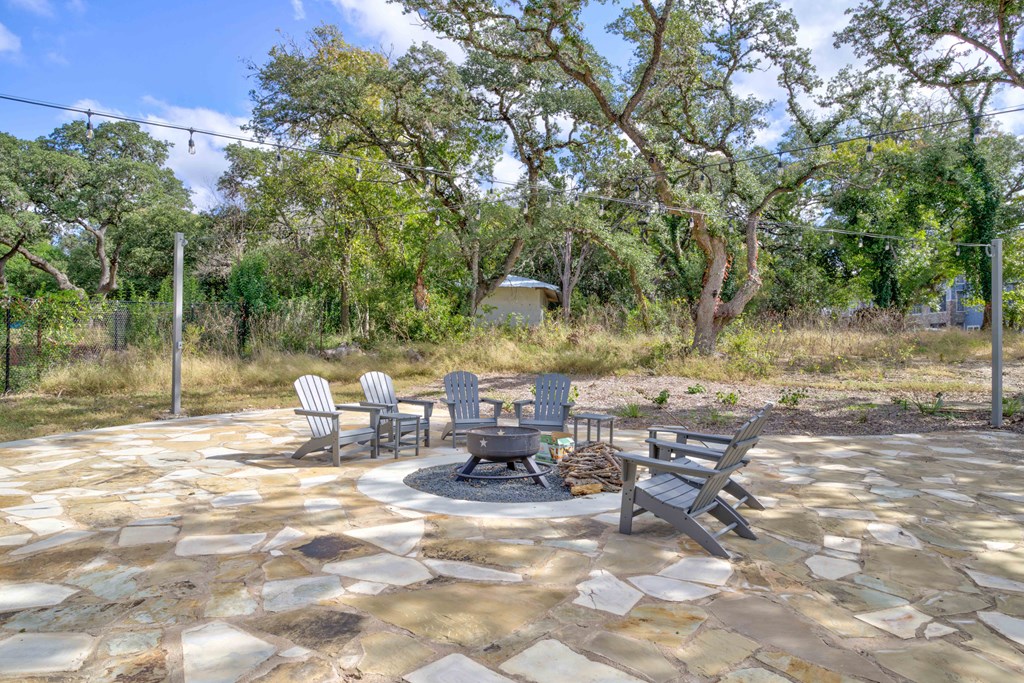 a patio with chairs and a fire pit at LIV at Boerne Hills an Active Senior Community 62+, Boerne