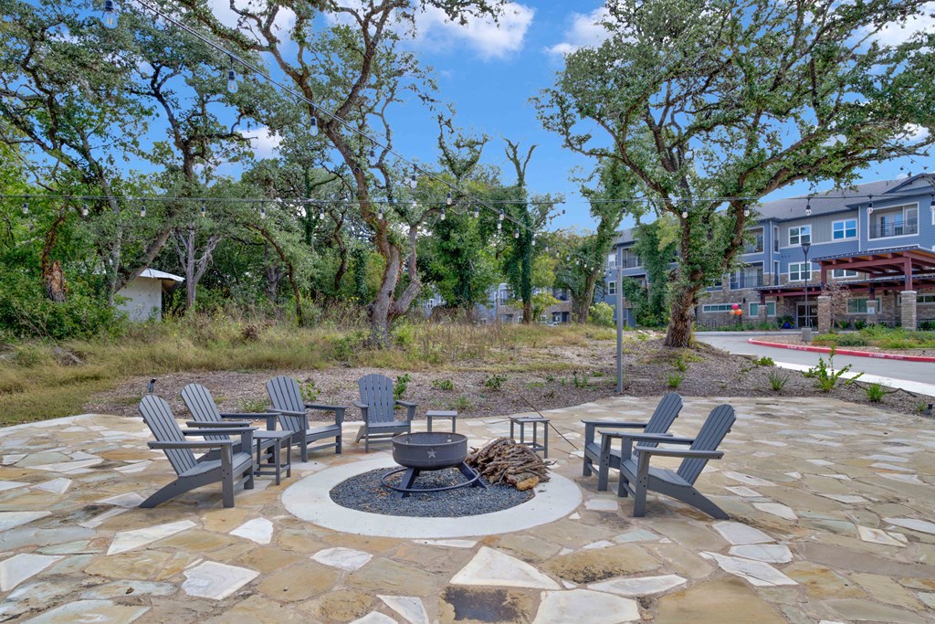 a patio with chairs and a fire pit at LIV at Boerne Hills an Active Senior Community 62+, Texas, 78006