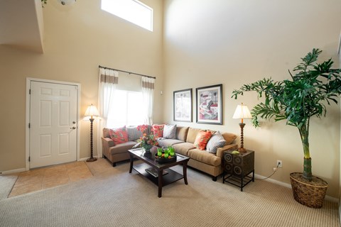 a living room with a couch and a table