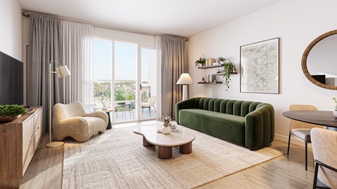 A living room with a green sofa and a coffee table.