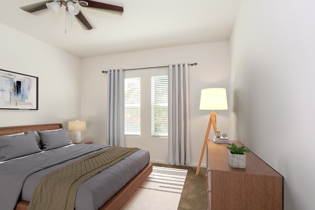 A bedroom with a bed, a nightstand, a lamp, and a painting on the wall.