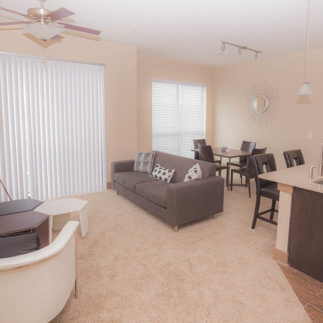 a living room with a couch and a table