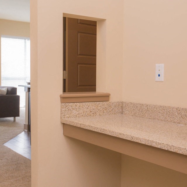 a view from the kitchen into the living room at the oxford at estonia apartments in