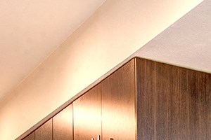 updated kitchen Apartments in Downtown Seattle for Rent - Metroline Flats - Modern Kitchen with Wood-Style Cabinets, Stainless Steel Appliances, and White Quartz Countertops - Photo Gallery