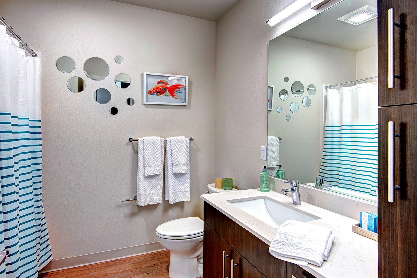 Downtown Seattle Apartments-Metroline Flats Apartments Bathroom With Wood-Style Flooring And White Marble Sinktop