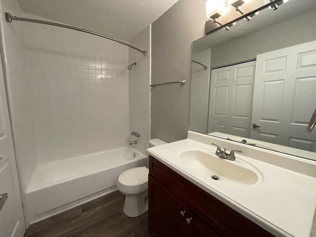 a bathroom with a sink toilet and bathtub
