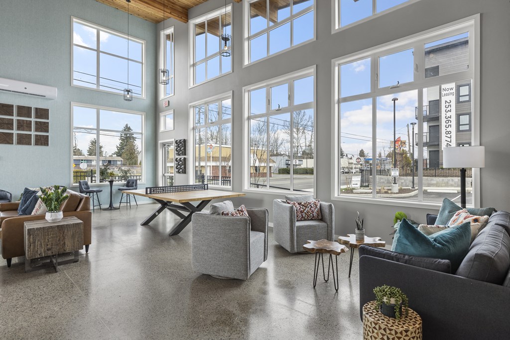 clubhouse with large windows and couches,