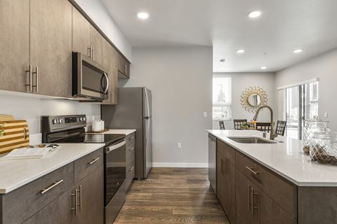 Apartments for Rent in Tacoma, WA - Pacific Ridge - Kitchen with Stainless-Steel Appliances, Quartz Countertops, and Sleek Designed Cabinets