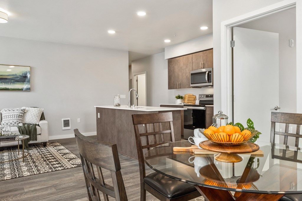 dining area with table and chairs, with access to living room and kitchen,