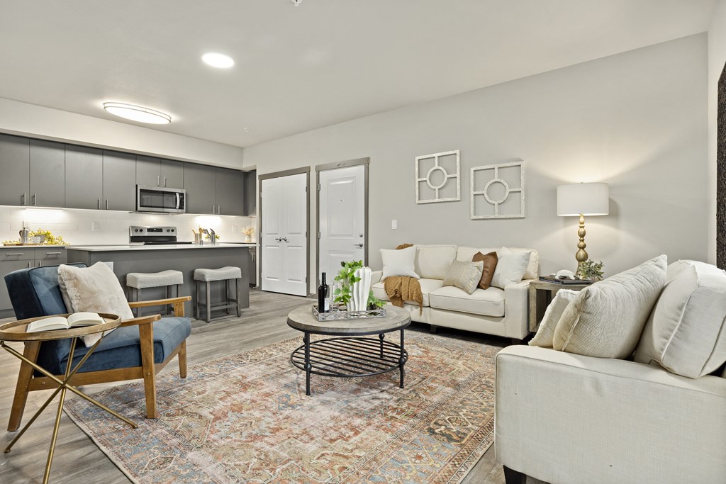 living room with couches and chairs,