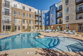 Lone Tree Apartments - Aspect Lone Tree Sparkling Pool with Spa and Lounge Chairs