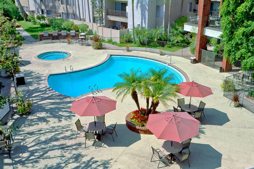 Downey Apartments for Rent - Park Regency Club Apartments Swimming Pool With Poolside, Shaded Patio Tables and Chairs
