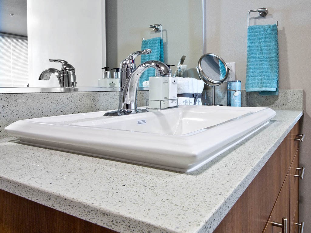 Designer granite countertops in all bathrooms at Astro Apartments, Seattle, WA