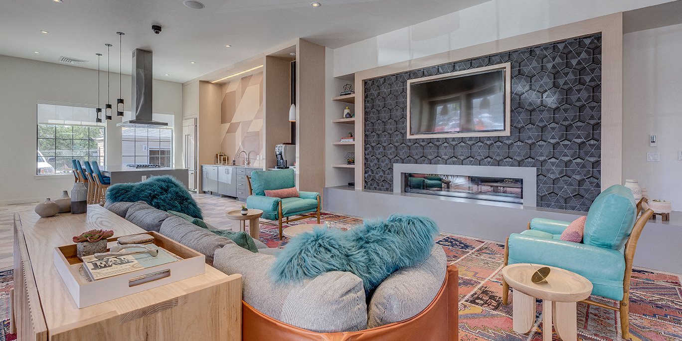 a living room with a couch and a fireplace