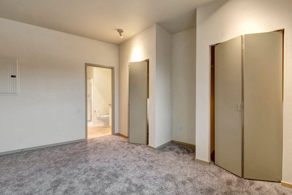 bedroom with adjacent bathroom