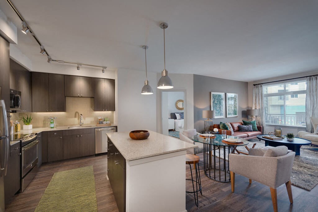 a kitchen and living room in an apartment
