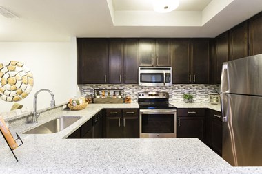 Channelside apartments in Fort Myers, Fl photo of Gourmet Kitchen w/ Modern Appliances
