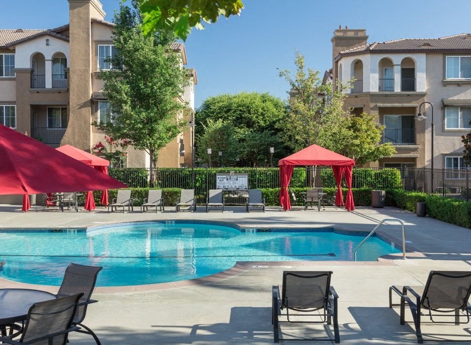 Dazzling Pool Area with Private Cabanas, Comfy Lounger Chairs, and Seating for All