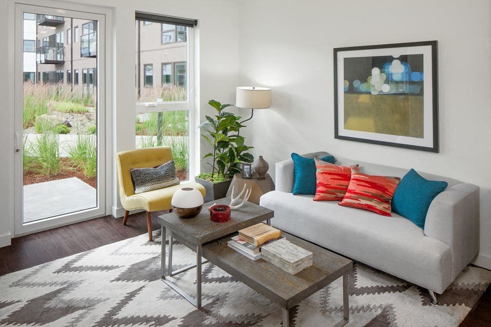 Dog-Friendly Apartments in South Portland OR - Oxbow49 - Spacious Living Room with Wood-Style Flooring