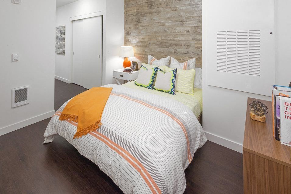 Three Bedroom Apartments in South Portland OR - Oxbow49 - Spacious Bedroom with Wood-Style Flooring