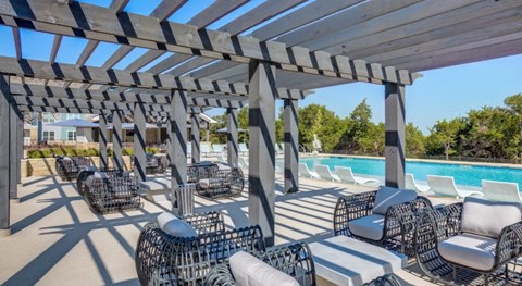 Outdoor pergola seating at Georgetown TX apartments near Wolf Ranch Town Center