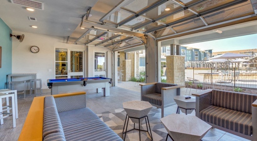 Apartments Georgetown - Williamson at the Overlook Lounge with Pool Table, Comfortable Seating, and View of Swimming Pool