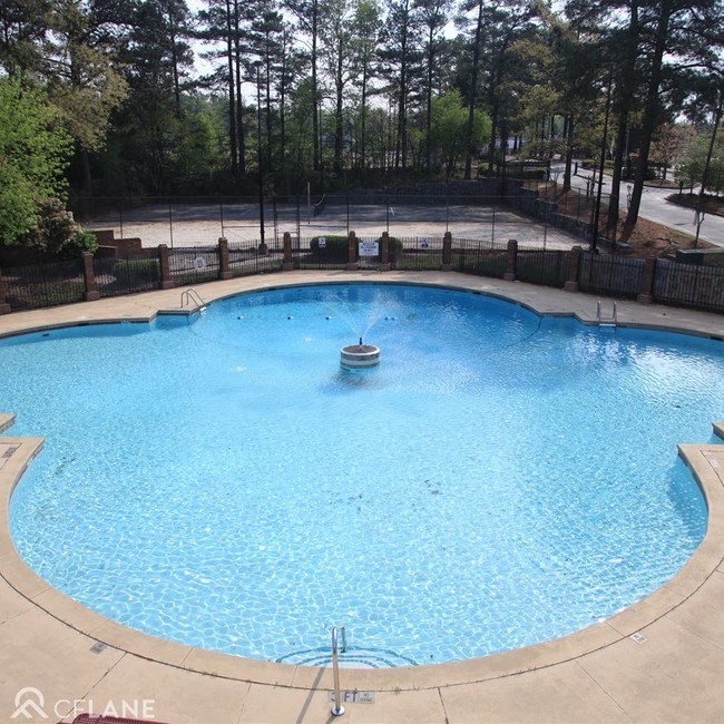 Pet-Friendly Apartments in College Park, GA - Beacon Ridge - Pool with a Fountain in the Middle