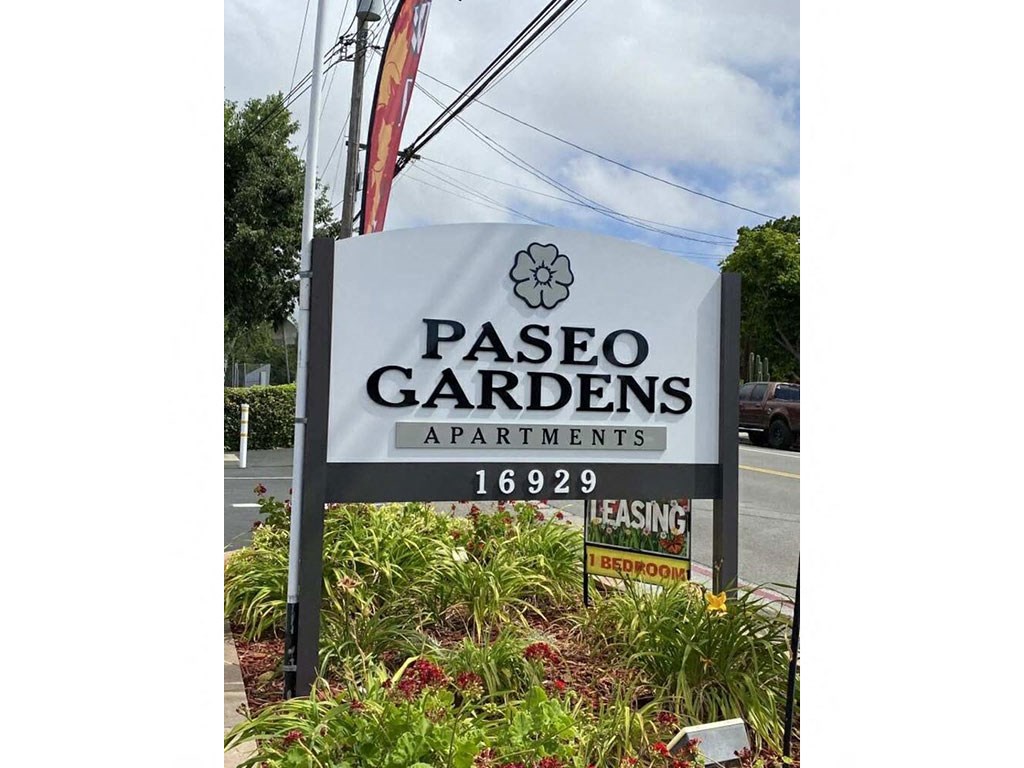 a sign for pasco gardens apartments