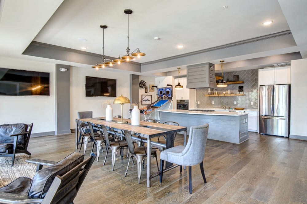 Community room with large dining area next to modern kitchen
