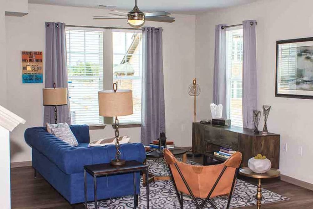 Living area with modern furnishings and large windows with natural light