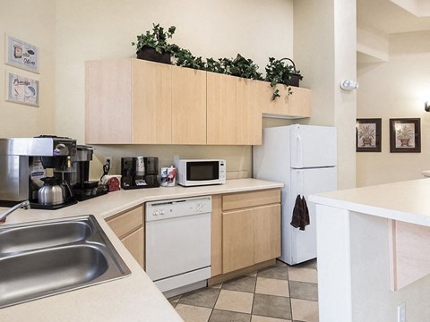 a kitchen with a sink and a refrigerator