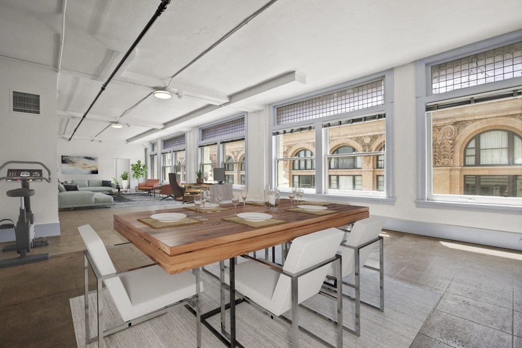 a dining room with a wooden table and white chairs