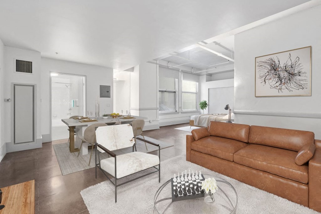 a living room filled with furniture and a large window