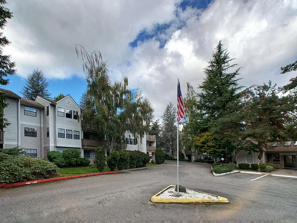 a flag pole in the middle of an empty street