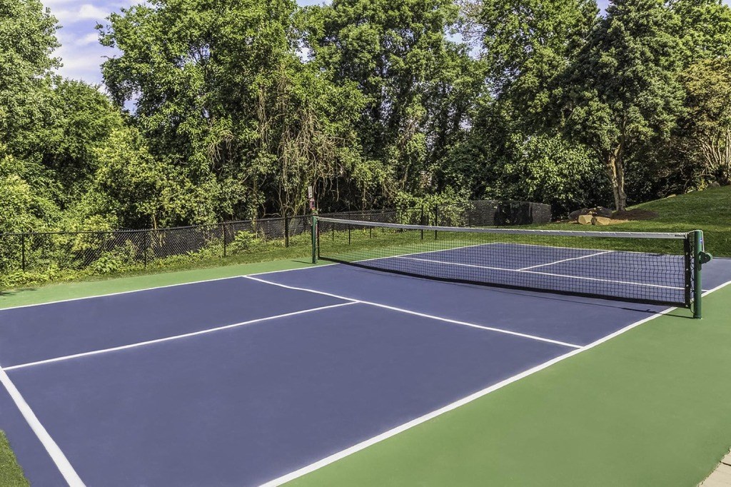 a tennis court with a net on top of it