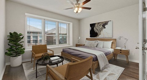 a bedroom with a bed and a ceiling fan