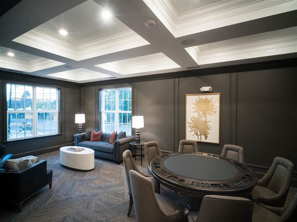 a living room with a round table and a couch